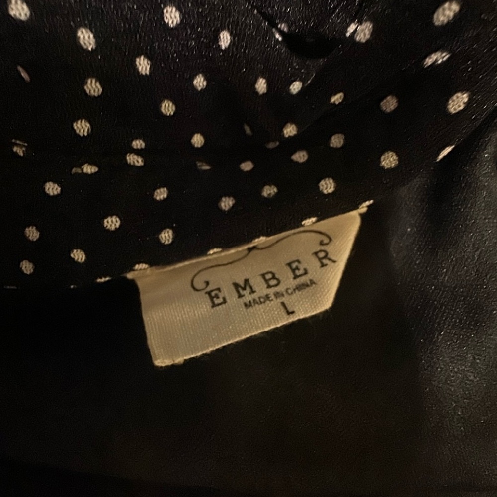 Two dress shirts. Size Large in Women’s. Good condition.